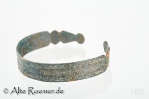 Ancient bronze bracelet with snake head decorations