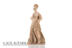 Hellenistic clay figurine of a standing woman