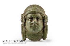 Roman bronze mount shaped as a female face Roman bronze mount shaped as a female face