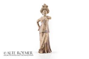 Tanagra figurine with partially preserved polychrome painting