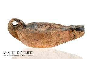 Roman oil lamp with kissing lovers in mirror - parallel in a museum