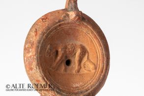 Roman oil lamp with rare panther relief in mirror